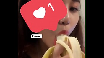 Girl learning to eat bananas