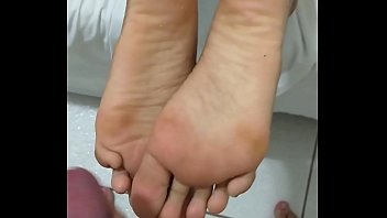 Cumming and smelling the sole of the little bitch's feet