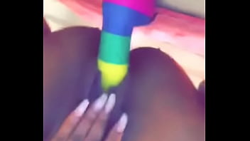 Ebony babe sits on fake dick