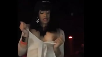 Cardi B stripping in a nightclub.