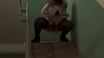 Golden shower in public places, bbw with a big ass and with a hairy pussy pissing on the stairs in the common entrance.
