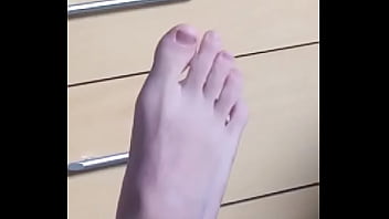 white boy playing with his delicious foot