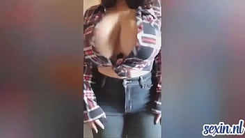 Lovely teen with big tits shakes them
