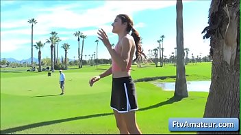 Young petite brunette Adria reveal her pussy on the golf course and gets naked