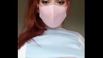 busty redhead showing off her big tits