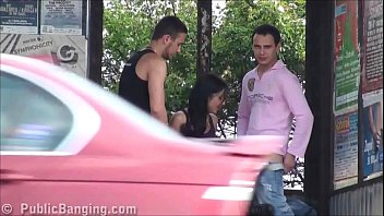A big natural breasted brunette in public street bus stop threesome orgy gang bang with 2 hung guys with big dicks fucking her with a blowjob and vaginal pussy sex action in front of all the car, bus, and truck drivers and people walking on the street