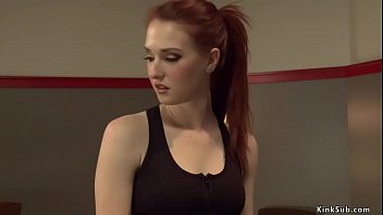 Redhead is machine fucked in gym