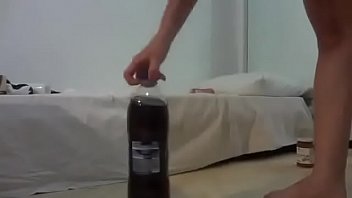 Putting the whole bottle in the pussy