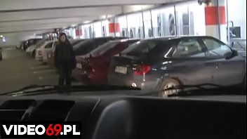 A h. girl gives a blowjob in car on the parking lot of a shopping mall
