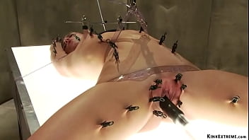 Clamped babe machine fucked