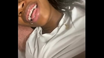Ebony with braces in her mouth