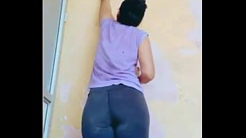 Client helps us lift paint off the wall and I record her buttocks as she does it.