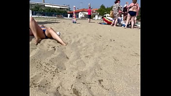 Wife exposes Pussy beneath panties on a public beach
