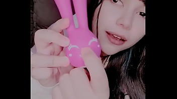 Curious girl masturbating with a bunny toy