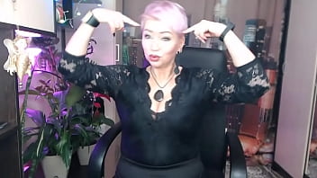 A depraved mature bitch with purple hair and big tits masturbates...