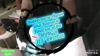 Rubbernurse Agnes - aka Batnurse with a long black rubber apron - pegging with various dildos, finally use of HUNG´R´s 17,5" BRUTUS until cum