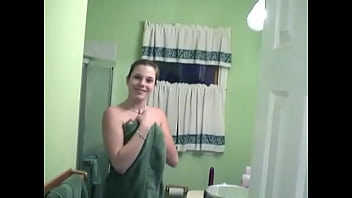 Curvy little slides vibrator in her pussy while taking a shower