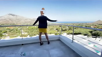 sexy real estate business woman used on a public balcony