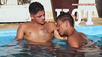 Trio of young men making out in the pool
