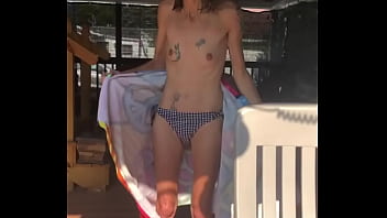 Skinny tattooed granny taking her bathing suit off