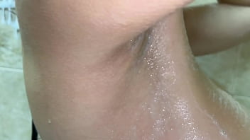 Peeping as a neighbor's wife with big tits washes in the bathroom