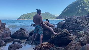 Big-tailed wife in a thong having sex on the beach