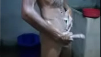 Young Thai man takes a shower and shows off his cock