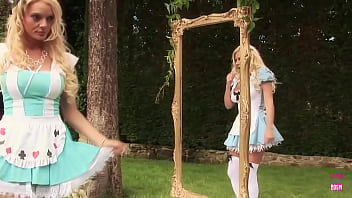 Two blonde look-alikes fuck each other outdoors with their massive dildos